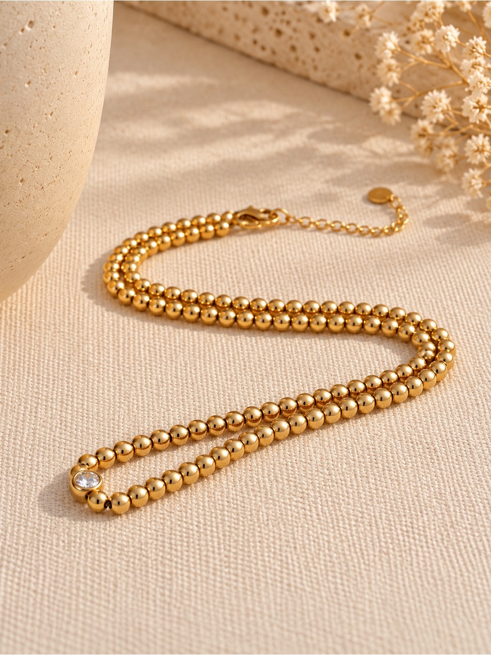 Gold Beaded Necklace with Single Crystal Accent